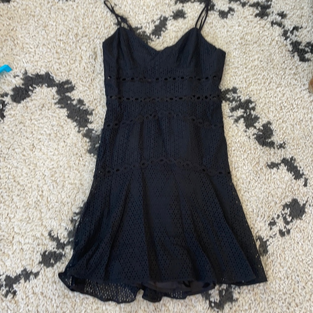 Fitted black eyelet dress